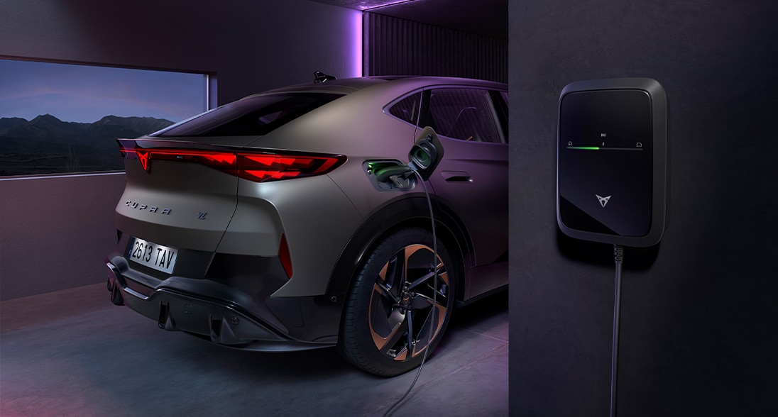 2024 cupra born electric car wall charger, rear of vehicle, red rear lights, cupra logo